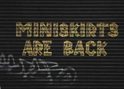 gray background with miniskirts are back text overlay