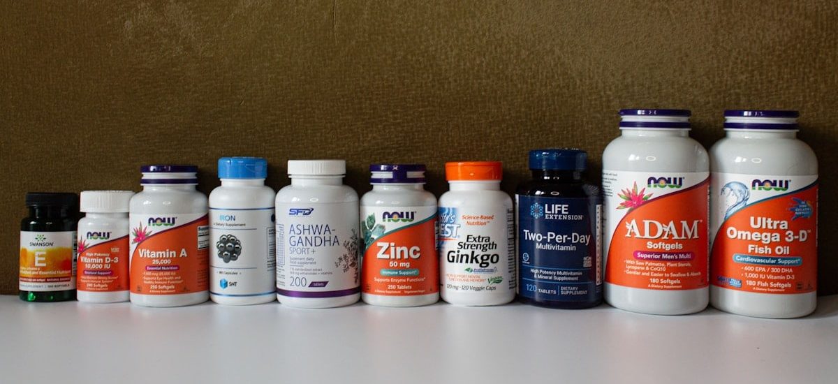 a row of bottles of different types of vitamins