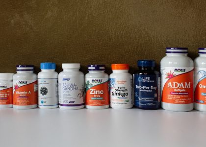 a row of bottles of different types of vitamins